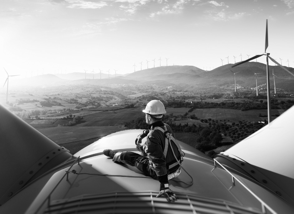 Man on top of wind turbine