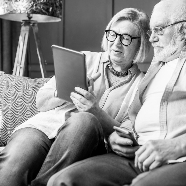 Mature couple looking at tablet