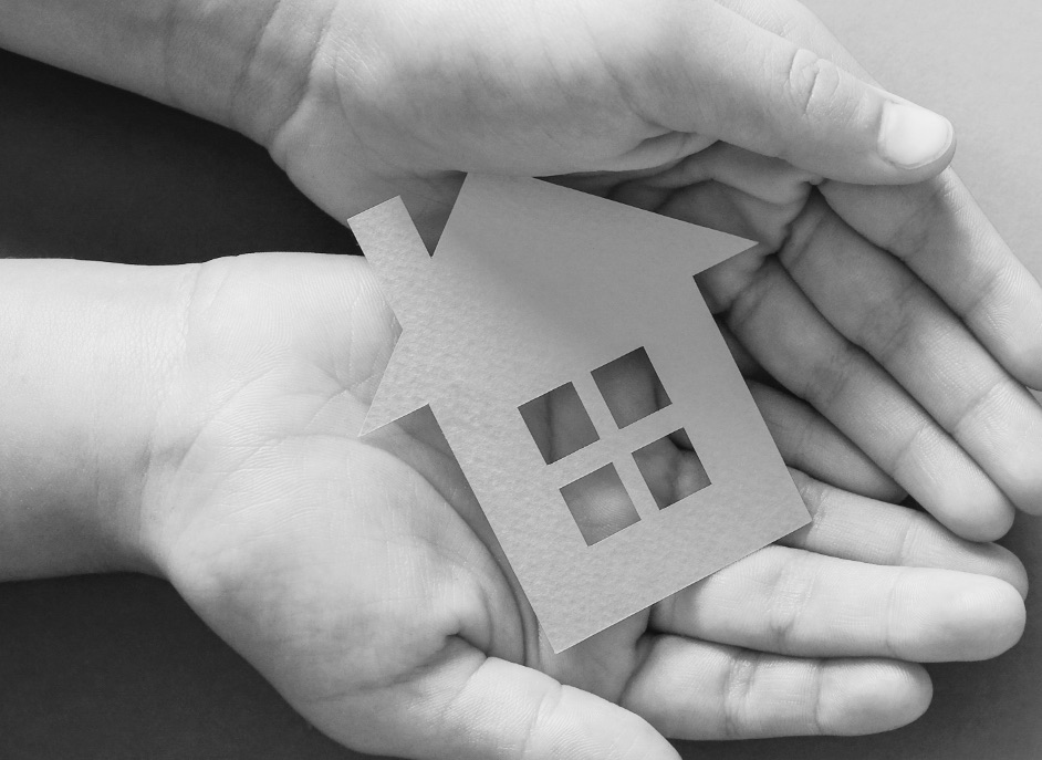 Person holding house in hands